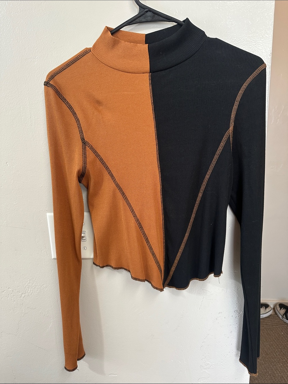 Gilded Intent Two-Tone Mock Neck Long Sleeve Top in Black and Rust